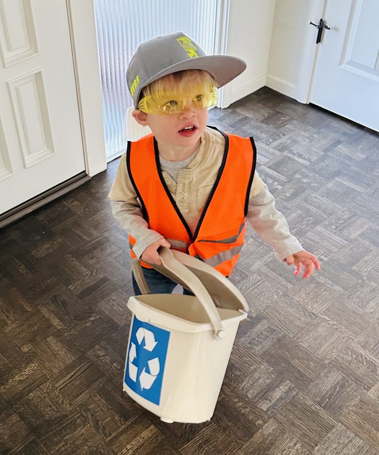 Image: Child wearing garbage collecter outfit for Halloween