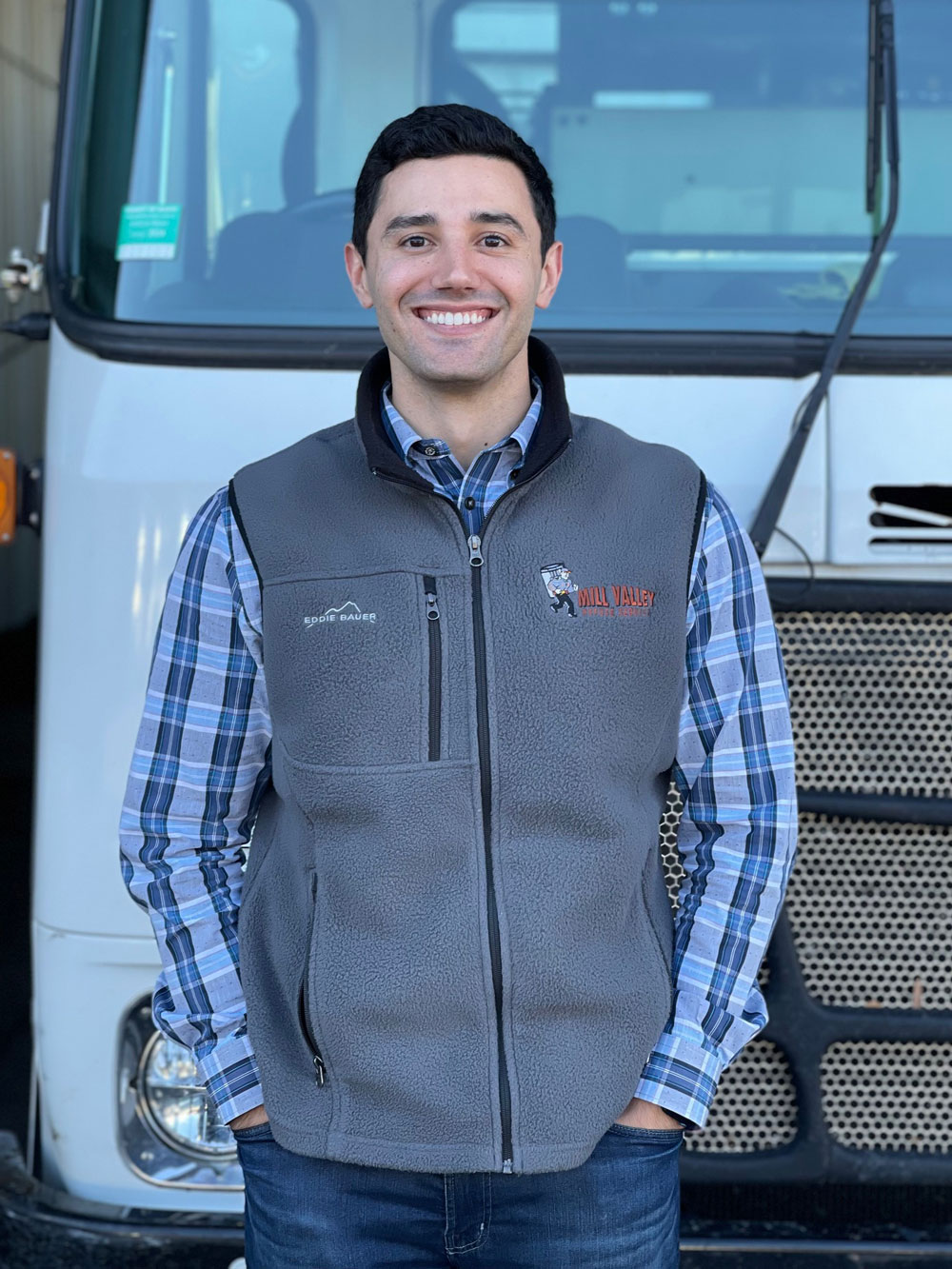 MVRS Owner Gene stands in front of a truck smiling