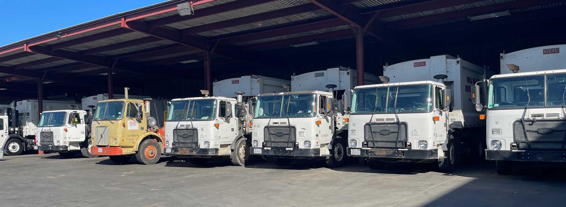 A row of garbage trucks in line at the MVRS yard.